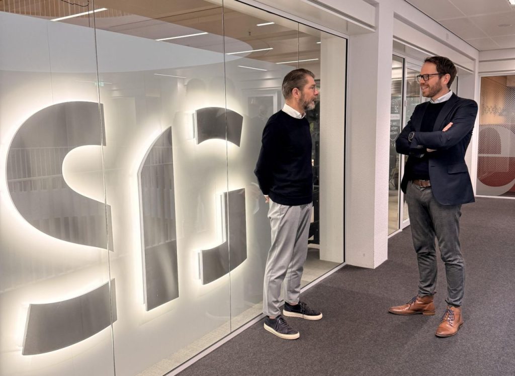 This is an image of Werner & Erik talking to each other in front of the Software Improvement Group office