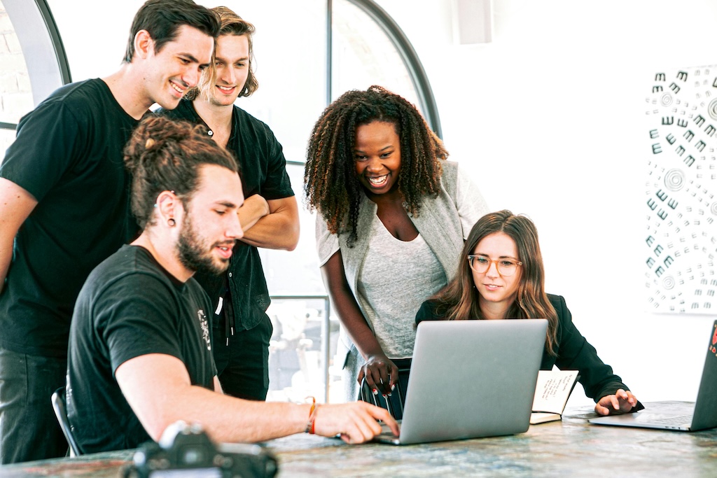 A group of colleagues having a discussion in a sustainable office space.