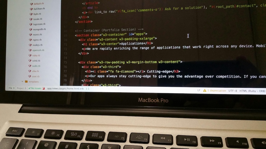 image of a macbook displaying optimized software/code