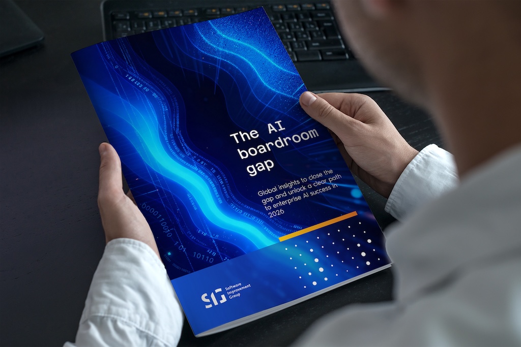 A corporate person holding the AI boardroom gap report from Software Improvement Group