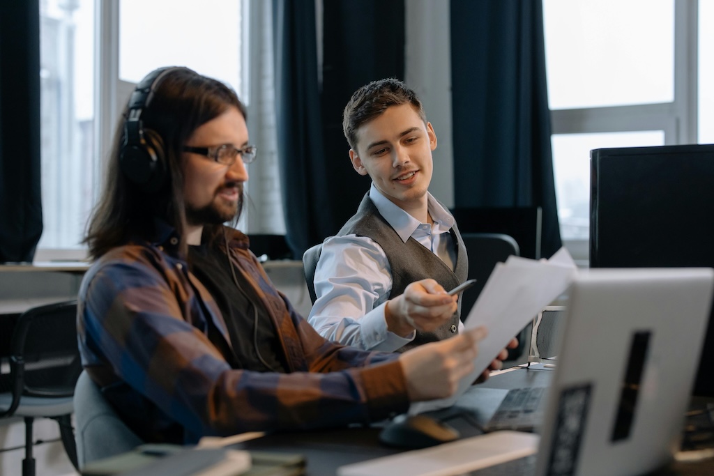 an IT leader presenting the SQP to one of his developers. 