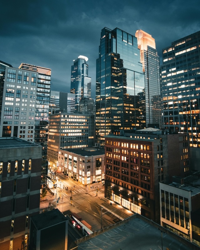 A skyline of a corporate landscape at nighttime. 