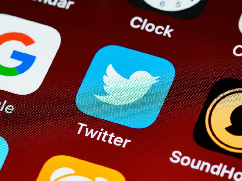 Image of the Twitter app icon on a phone screen.