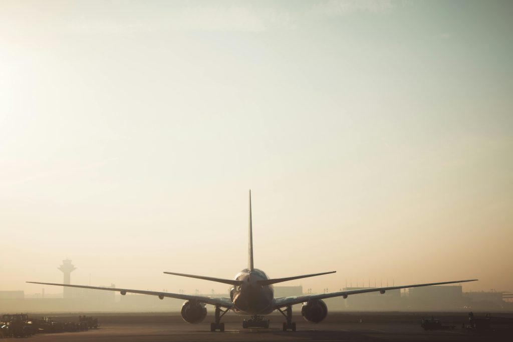 Image of a flight taking off early in the morning.